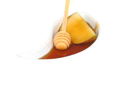 bir dilim elma ile bal damlatıcı tatlım