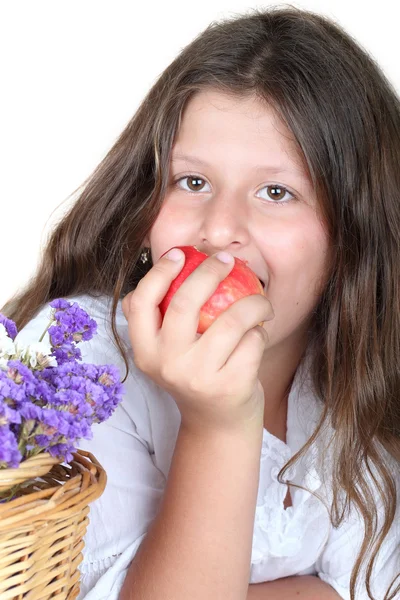 Девушка кусает яблоко Стоковая Картинка