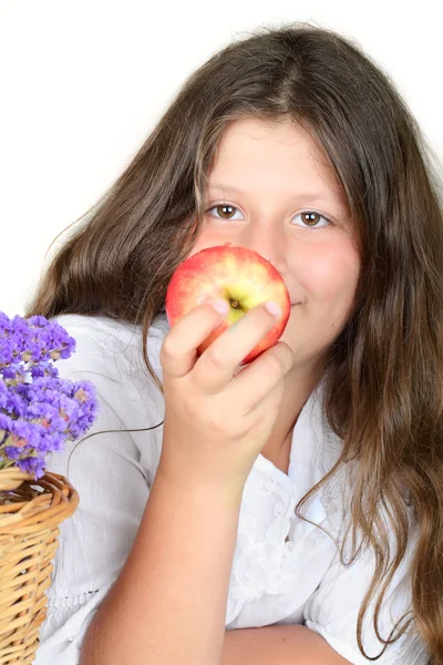 Girl biting an apple — Stock Photo, Image