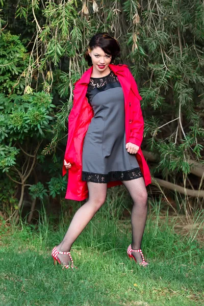 Women in red coat — Stock Photo, Image