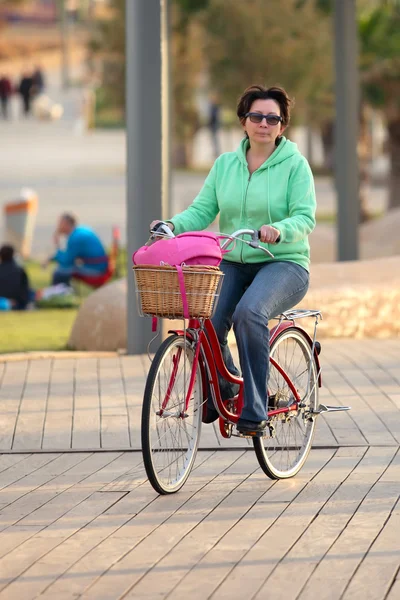 Woman on bicycle — Stock Photo, Image
