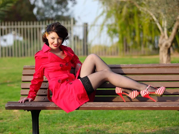 Women in red coat — Stock Photo, Image