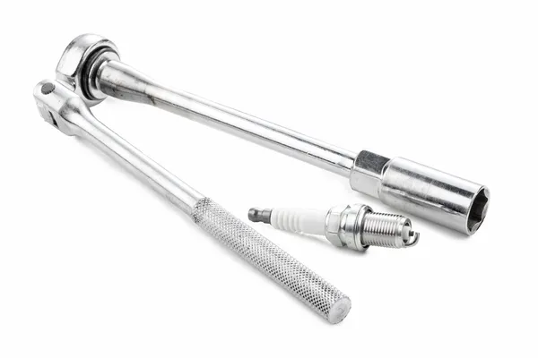 Spark plug and ratchet — Stock Photo, Image