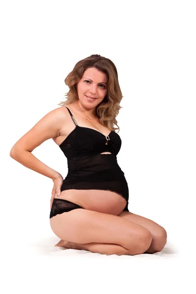 Attraktiv ung gravid tjej med brunt hår — Stockfoto