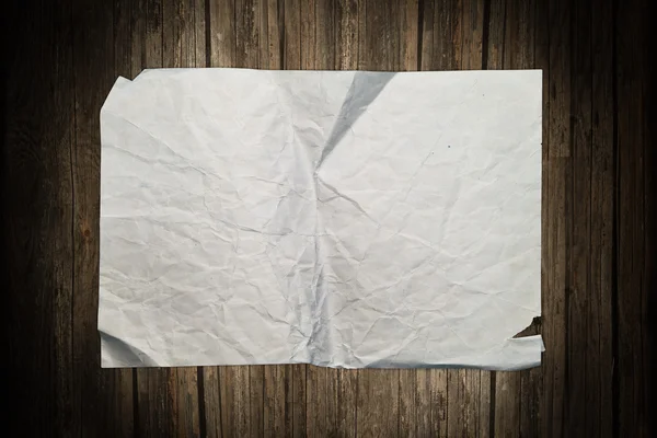 Blank old paper sheet on a wooden background — Stock Photo, Image