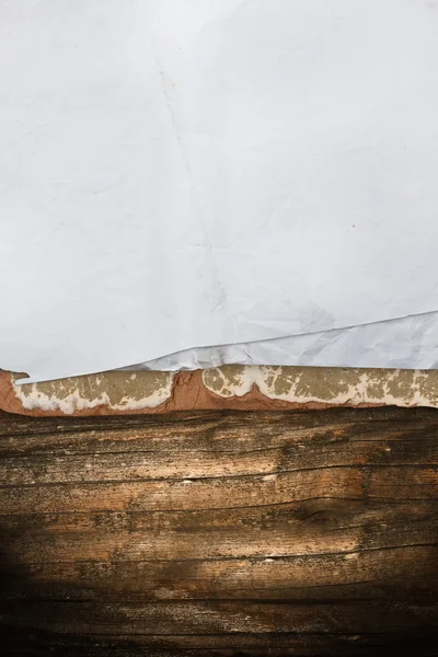 Wrinkled paper sheet on a dark wooden background — Stock Photo, Image