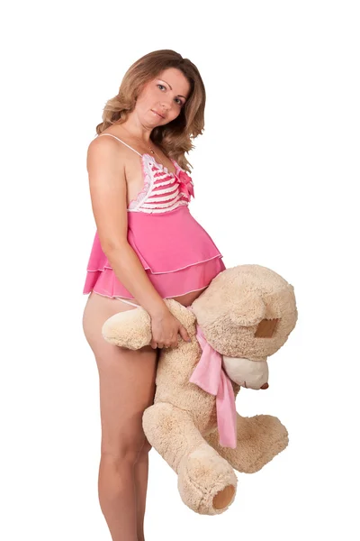 Vackra gravid flicka med en leksak — Stockfoto