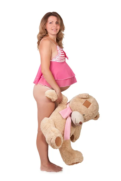 Mignonne enceinte fille tenant ours en peluche — Photo