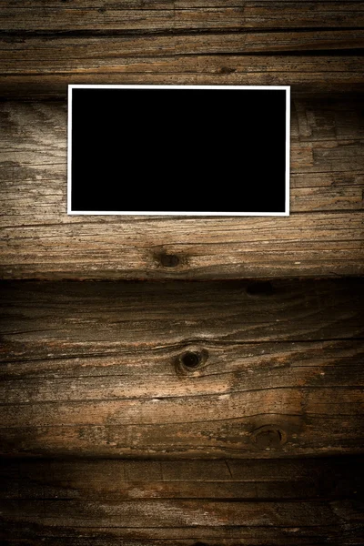 Fotorahmen auf Holzgrund — Stockfoto