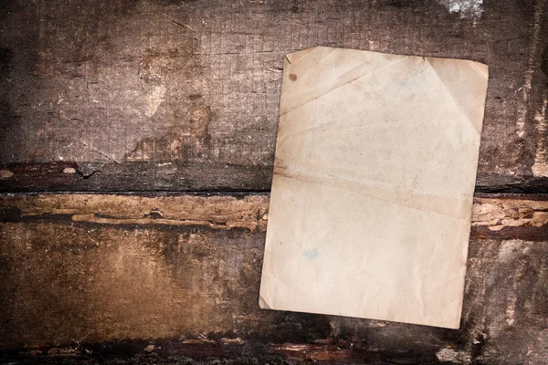 Faded old paper on a grungy background — Stock Photo, Image