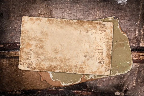 Faded old paper on a grungy background — Stock Photo, Image