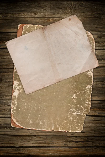 Aged papers on wood — Stock Photo, Image