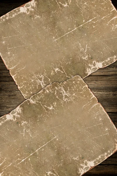 Papel envelhecido sobre madeira — Fotografia de Stock