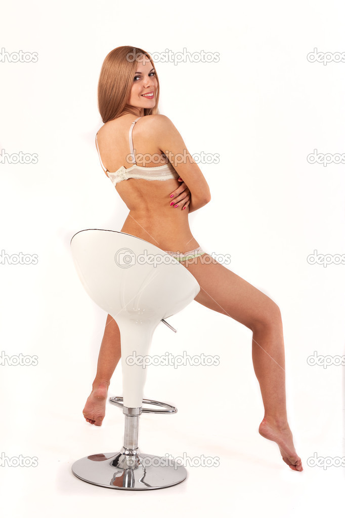 Young attractive lady with gorgeous face — Photo by ... Sexy hot girl in a chair — Stock Photo © exshutter #48656141