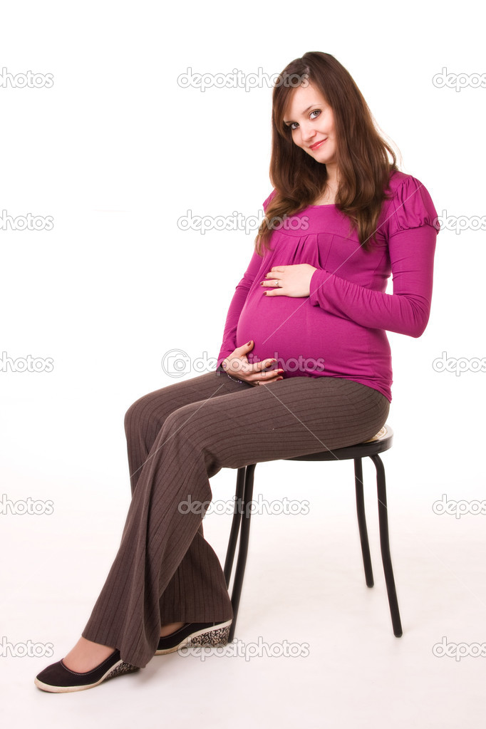 Beautiful pregnant woman - isolated over a white background