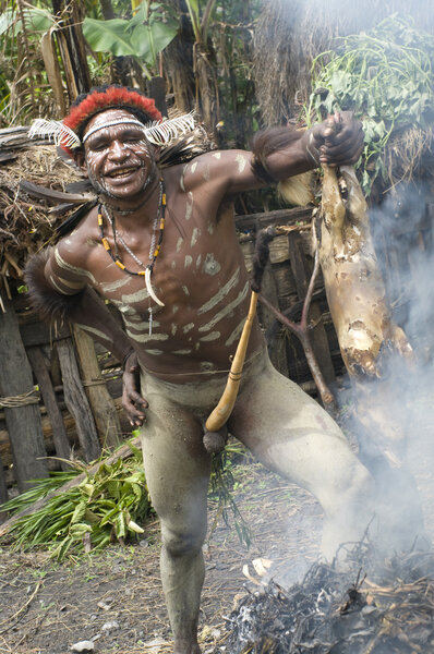 warrior of a Papuan tribe in traditional clothes