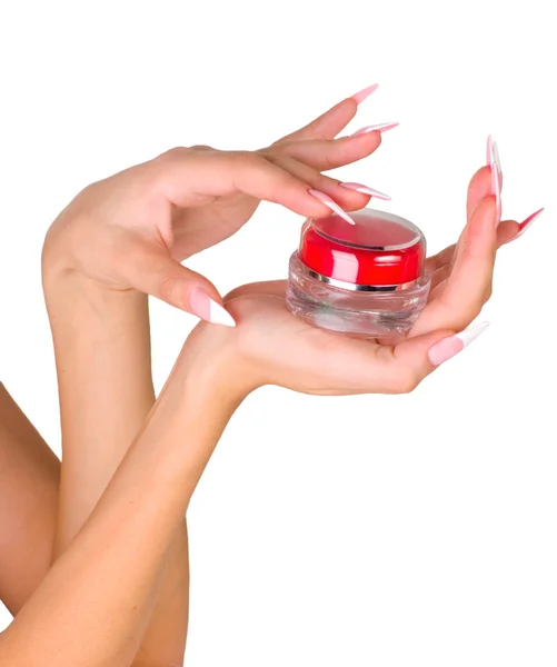 Belas mãos femininas com o produto cosmético — Fotografia de Stock