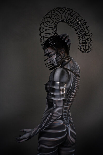 Portrait of an artistic woman painted colors.