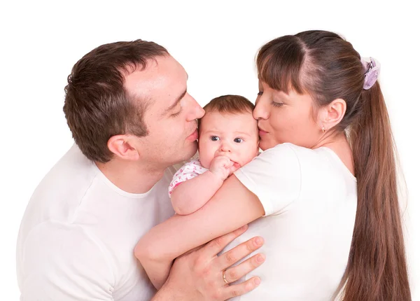 Father and mother kissing her baby — Stock Photo, Image