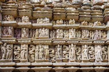 Stone carved erotic bas relief in Hindu temple in Khajuraho