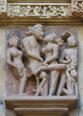 Stone carved erotic bas relief in Hindu temple in Khajuraho