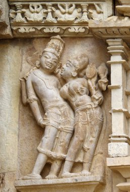 Stone carved erotic bas relief in Hindu temple in Khajuraho