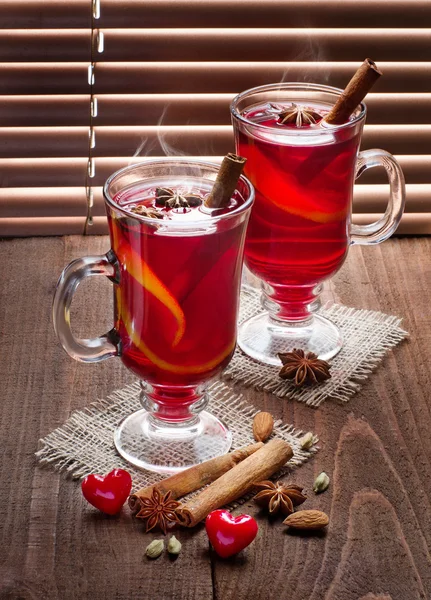 Two glasses of mulled wine on old wooden table — Stock Photo, Image