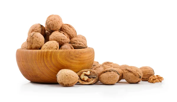 Wooden bowl full of walnuts on white background — Stock Photo, Image