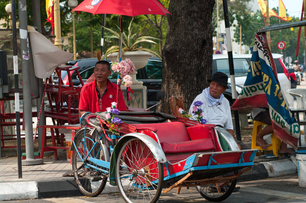 Trishaw driver  in George Town, Malaysia.