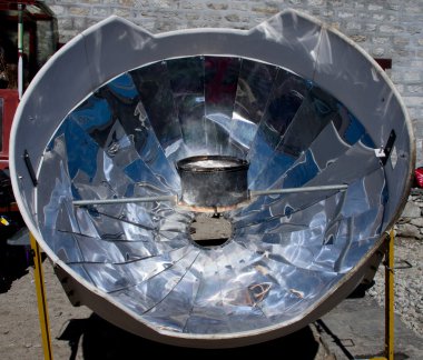 Solar cooker in the Himalaya mountains. clipart