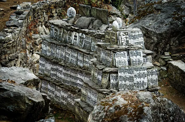 Stone with the Buddhist mantras — Stock Image Stone with the Buddhist mantras Royalty Free Stock Images