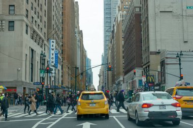 New York, USA - November 18, 2018: Yellow NYC taxi cab on the street in New York City