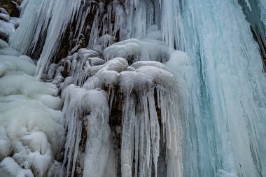 Frozen Awosting Falls, massive icicles hang from the cliffs in Minnewaska State Park in Upstate New York. USA clipart