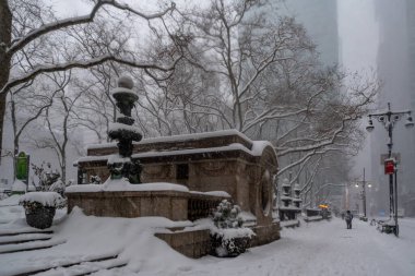 Snow storm in New York City. Manhattan During Nor'easter Blizzard. View of Bryant Park