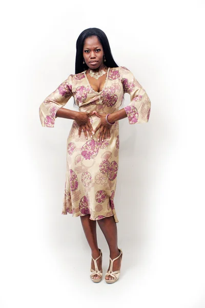 Mooie vrouw in een stijlvolle jurk — Stockfoto