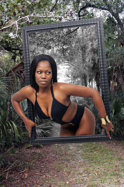 Sexy Woman Emerges from Picture Frame — Stock Photo, Image