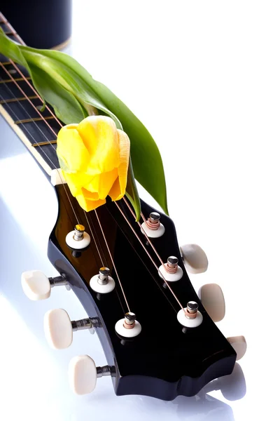 Guitar and yellow tulip. — Stock Photo, Image