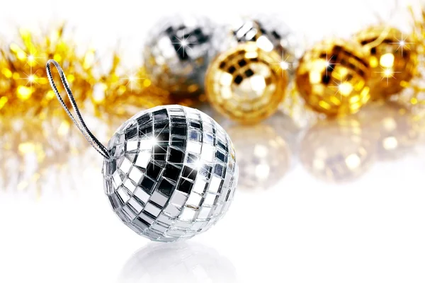 Mirror spheres and New Year's tinsel. — Stock Photo, Image