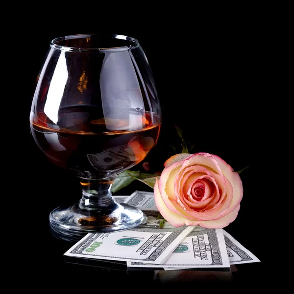 Glass, rose and dollars. — Stock Photo, Image