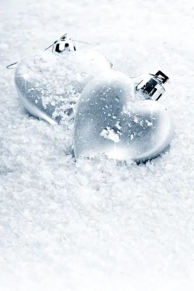 Two hearts on snow — Stock Photo, Image