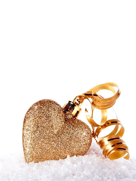 Heart with gold tape on snow — Stock Photo, Image