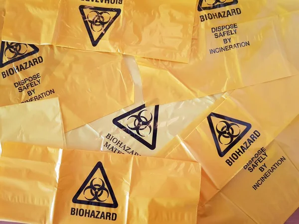 Sign Biohazard Painted Yellow Bags — стоковое фото