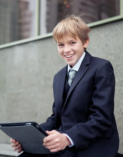 School boy with electronic tablet sitting, — Stock Photo, Image