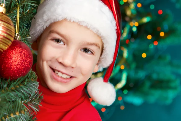 Happy small boy in santa hat — Stock Photo, Image