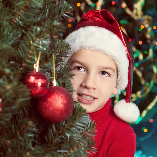 Happy small boy in santa hat — Stock Photo, Image