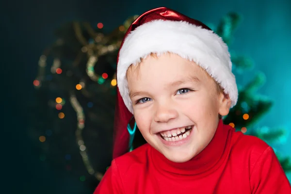 Happy small boy in santa hat — Stock Photo, Image