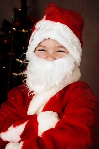 Gelukkig kleine jongen in Kerstman hoed — Stockfoto