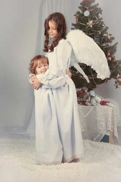 Portrait of two happy sisters, christmas — Stock Photo, Image