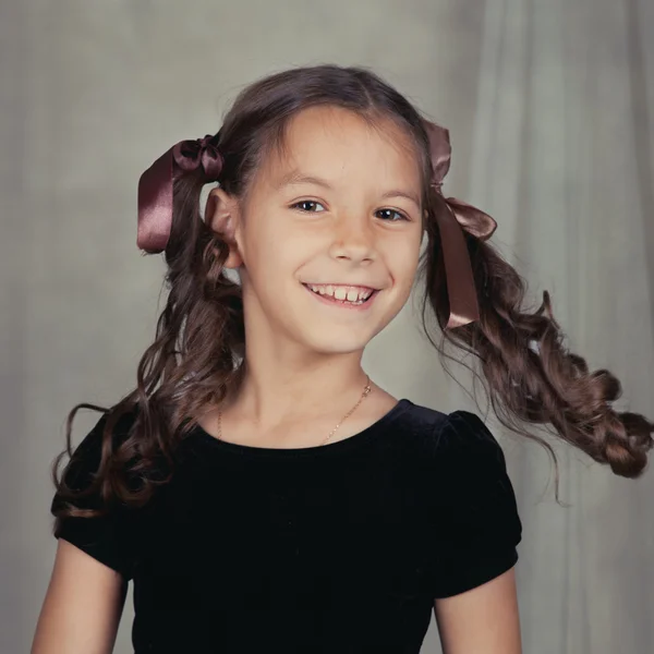 Portrait of beautiful girl with curly hair — Stock Photo, Image