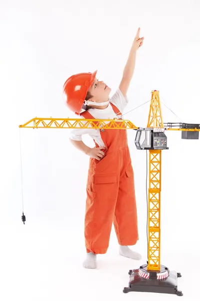 Small builder and crane on white background — Stock Photo, Image